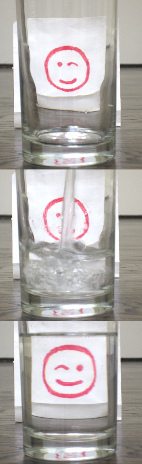 smiling face behind glass, water poured into the glass, reversed smiling face behind glass full of water