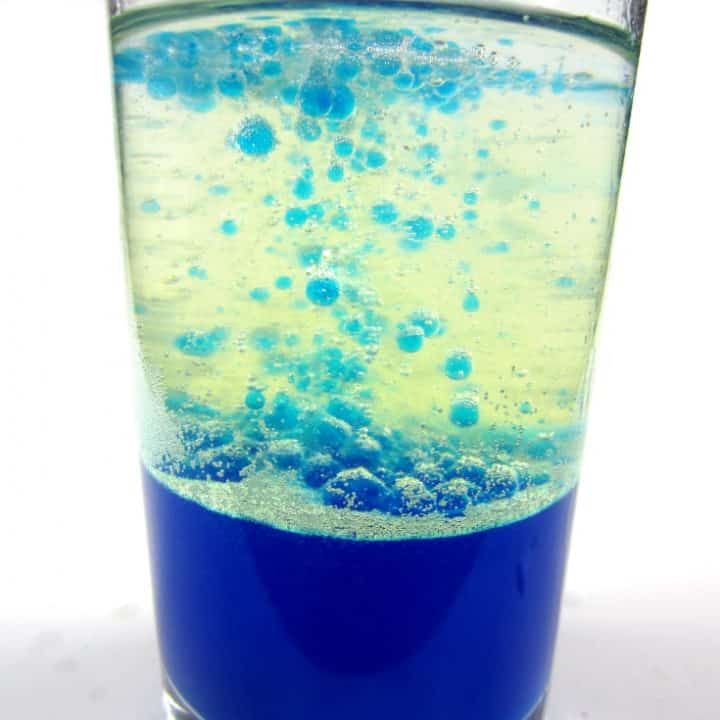 Lava lamp in a glass using water, oil and blue food coloring