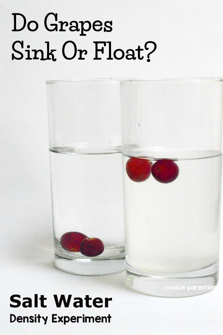2 clear glasses of water, one with 2 floating grapes, the other 2 sinking grapes.