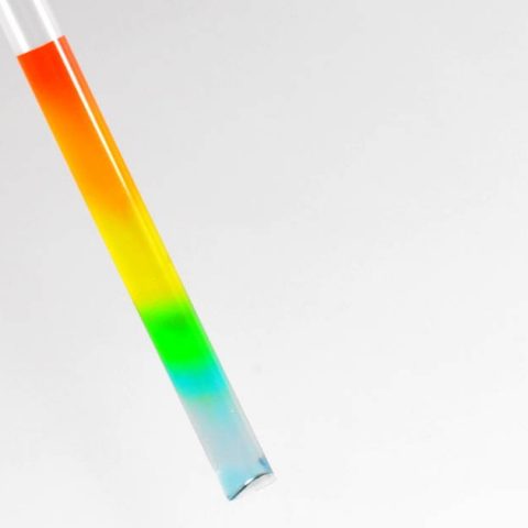 rainbow colored water inside a transparent straw, Sugar Rainbow science experiment